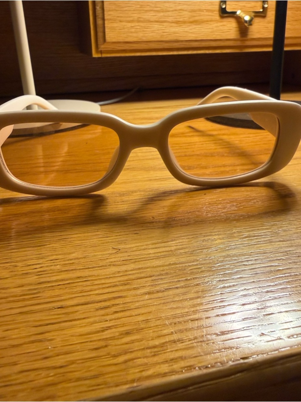 Chunky Rectangular Sunglasses in White with Bedazzled flowers on side.